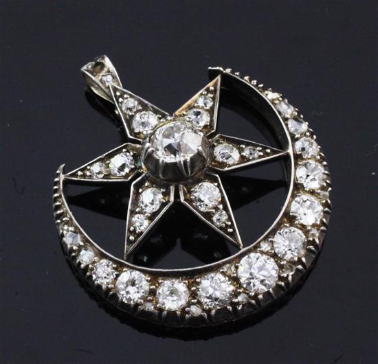 A Victorian gold and silver, diamond crescent and star brooch, now converted to a pendant, pendant 1.25in.